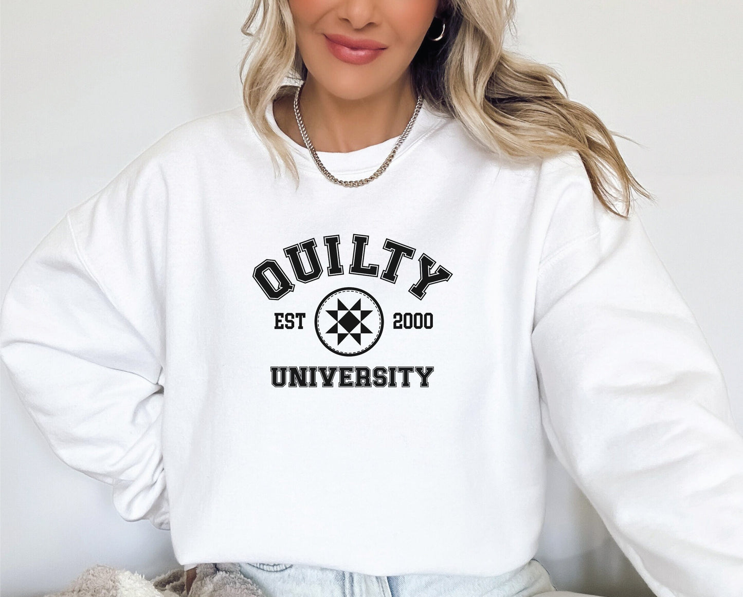 Quilty University collegiate style sweatshirt for women. Black print on grey, pink, white, and sand Gildan 18000 unisex sweatshirts. Personalize with the year you started quilting. Leave the year in the personalized box at checkout.