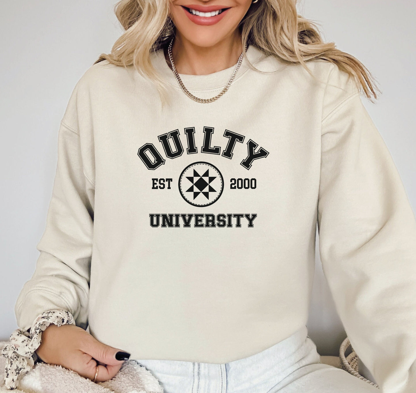 Quilty University collegiate style sweatshirt for women. Black print on grey, pink, white, and sand Gildan 18000 unisex sweatshirts. Personalize with the year you started quilting. Leave the year in the personalized box at checkout.