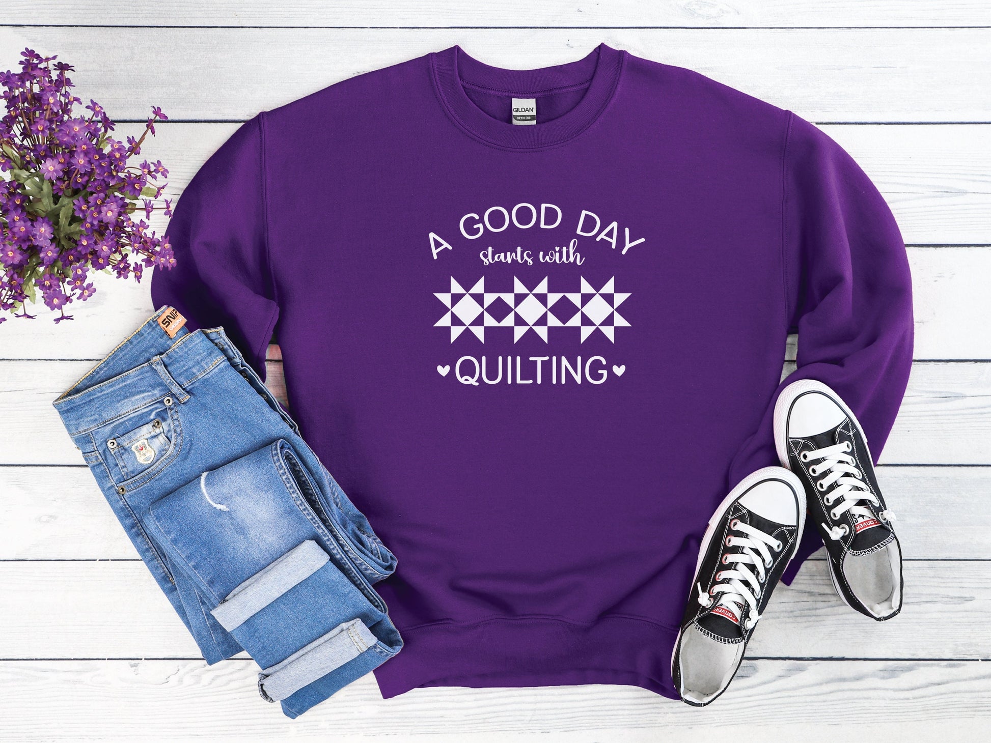 A Good Day Starts With Quilting Sweatshirt. Unisex sizing. Purple sweatshirt with fun white text.